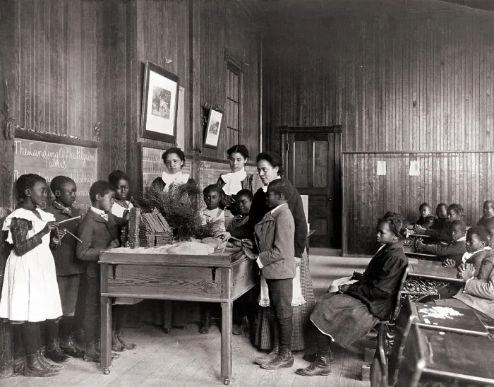 Framed Print : African American children learning about Thanksgiving, with model log cabin on table, Whittier Primary School, Hampton, Virginia