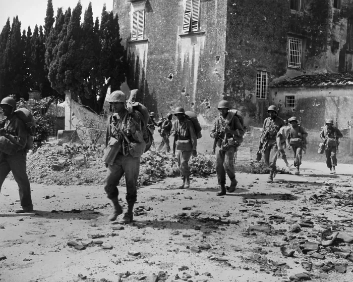 Framed Print : African American combat soldiers on patrol near bombed buildings, somewhere in Europe in 1944. In the spring of 1944, the U.S