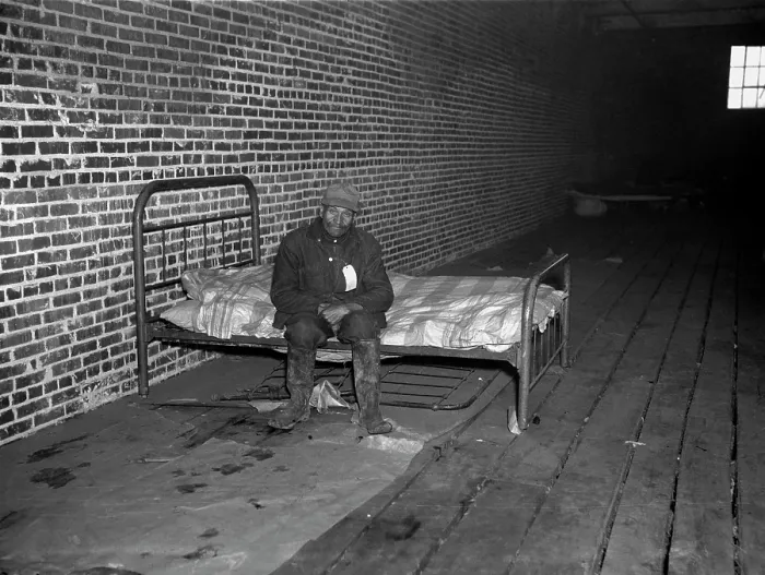 Framed Print : African American man in infirmary after flood, original title: Negro flood refugee in the Red Cross temporary infirmary of Forrest City, Arkansas