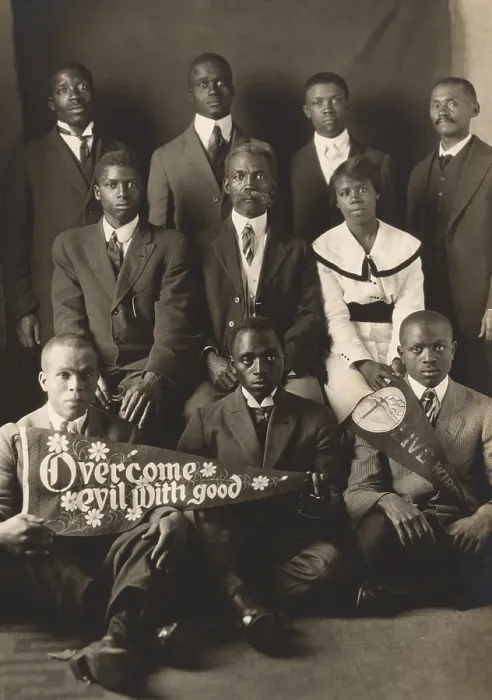 Framed Print : African American men and woman with Overcome evil with good and Live wires, banners. Photo by Arthur P