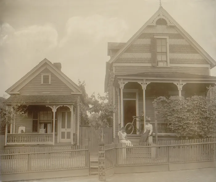 Framed Print : African American middle class neighborhood in Georgia, ca. 1899. Women and children are seated on their the porches and steps of their stylish homes