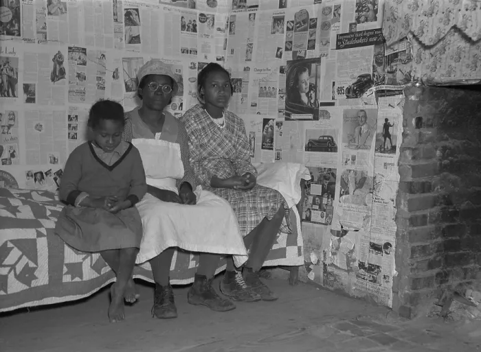 Framed Print : African American mother with her two daughters living in primitive conditions as plantation tenants in Gees Bend, Alabama