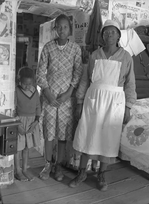 Framed Print : African American mother with her two daughters living in primitive conditions as plantation tenants in Gees Bend, Alabama