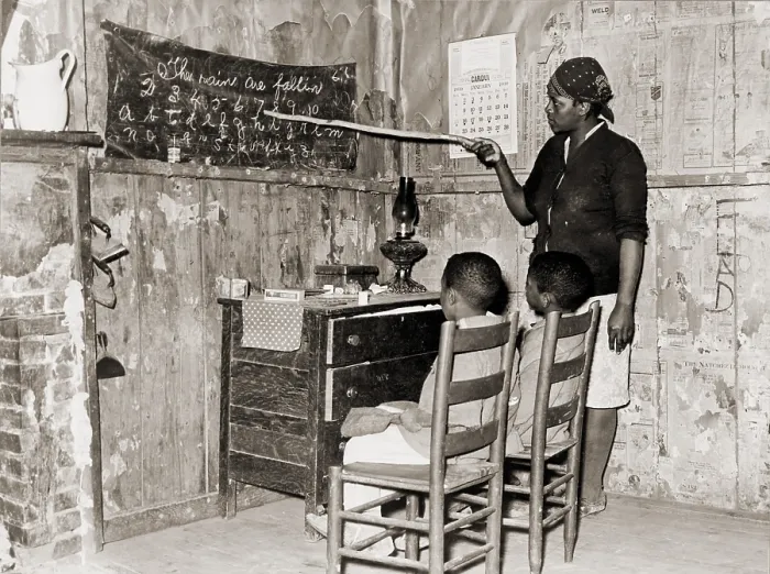 Framed Print : African American mother teaching children numbers and alphabet in their sharecropper home in Transylvania, Louisiana. 1937