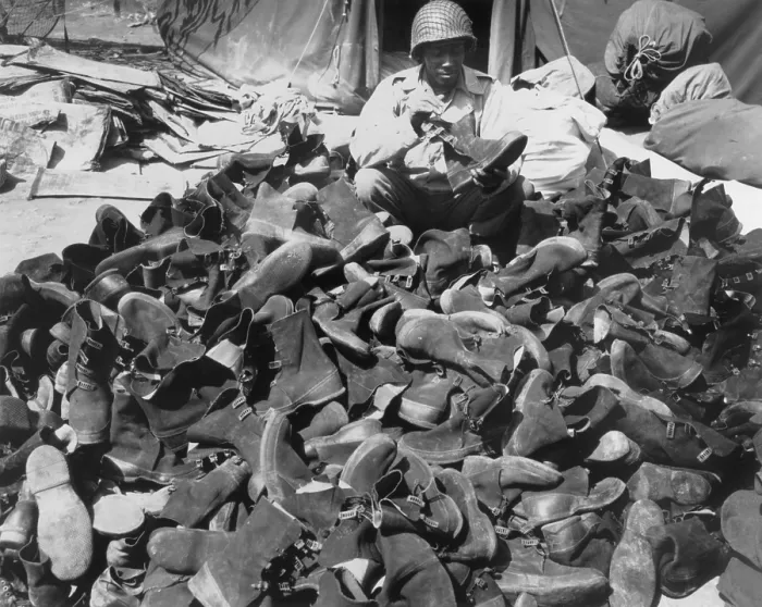 Framed Print : African American Pfc. Robert Askew with the 3278th Quartermaster Company in Italy. He is engaged in a non-combat task of maintaining overshoes used by combat troops