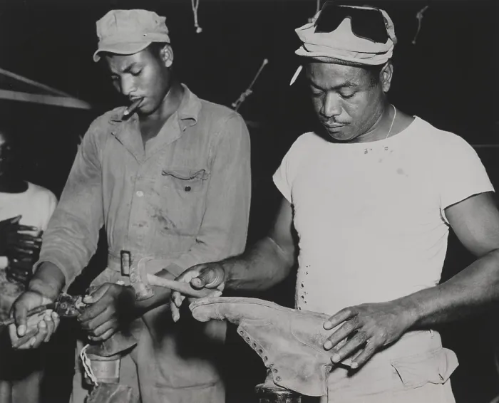 Framed Print : African American quartermaster soldiers repairing battle boots worn by fighting troops. They were stationed in the Marianas Island. Feb. 28, 1945. World War 2. (BSLOC_2014_10_227)
