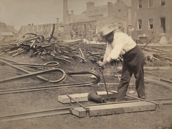 Framed Print : An African American railroad construction worker straightens track for the Union during the Civil War, 1862-63. Both sides twisted rails, as seen in the in background Framed Print : An African American railroad construction worker straightens track for the Union during the Civil War, 1862-63. Both sides twisted rails, as seen in the in background