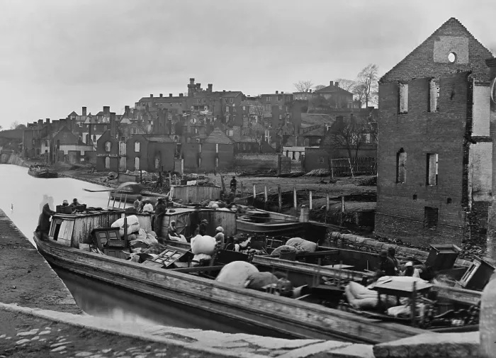 Framed Print : African American refugees sit in a boat with household belongings in a Richmond, Virginia canal