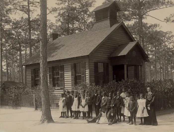 Framed Print : African American school children posed with their teacher outside a segregated one-room school, in South Carolina. Ca. 1905