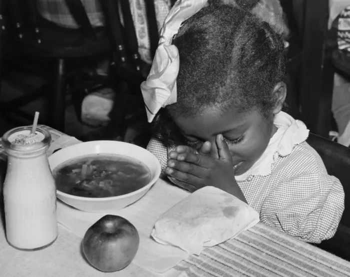 Framed Print : African American school girl saying grace. Her meal was subsidized by the Surplus Commodities, School Lunch Programs. Ca. 1937. (BSLOC_2013_7_56)