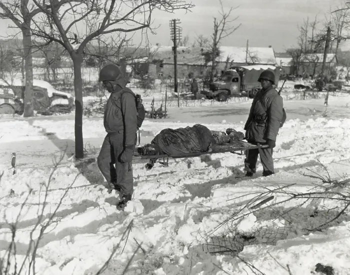Framed Print : Two African American soldiers carry the body of an soldier on a stretcher during World War 2