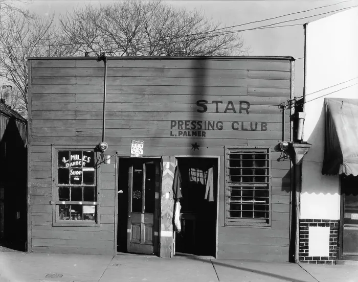 Framed Print : African American store fronts, original title: Shop fronts, laundry and barber shop, Negro shop, Vicksburg, Mississippi, photograph by Walker Evans, February, 1936
