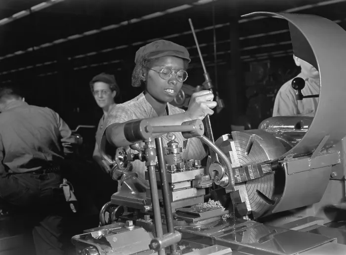 Framed Print : African American woman lathe operator at a Midwest supercharger plant. In the background are white workers in the racially integrated workforce during World War 2. Ca. 1942-45