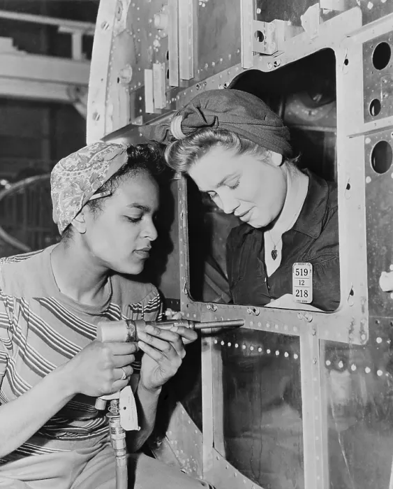 Framed Print : African American woman war worker with her white co-worker. Long Beach Plant of Douglas Aircraft Company had an racially integrated workforce during World War 2. Ca. 1942-45 Framed Print : African American woman war worker with her white co-worker. Long Beach Plant of Douglas Aircraft Company had an racially integrated workforce during World War 2. Ca. 1942-45