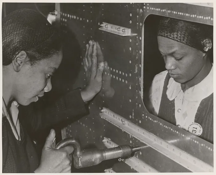 Framed Print : African American women riveters work on the center section of a bomber during World War 2. Ca. 1940-45. (BSLOC_2014_10_215) Framed Print : African American women riveters work on the center section of a bomber during World War 2. Ca. 1940-45. (BSLOC_2014_10_215)