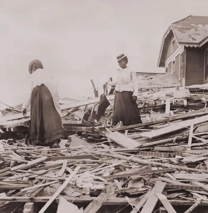 Framed Print : Two African American women on rubble trying to find where their Galveston home stood Framed Print : Two African American women on rubble trying to find where their Galveston home stood