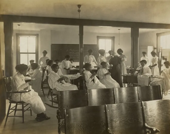 Framed Print : African-American women sewing by hand and with sewing machine in classroom, c. 1911-18
