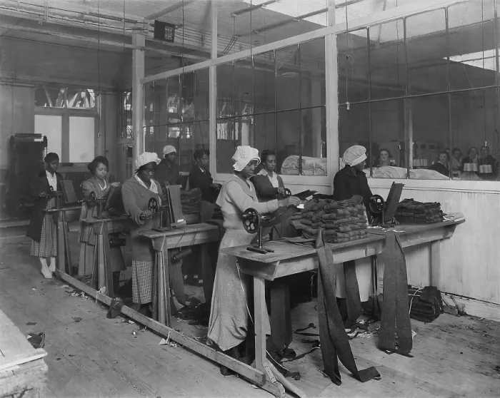 Framed Print : African American women workers manufacturing puttees in New York City, Nov. 4, 1918. On the other side of the windows, are women in a segregated White section of the factory Framed Print : African American women workers manufacturing puttees in New York City, Nov. 4, 1918. On the other side of the windows, are women in a segregated White section of the factory