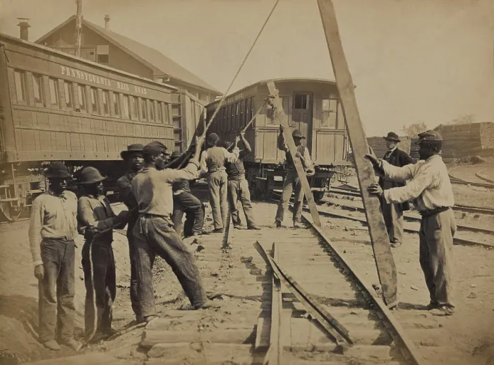 Framed Print : African American work crew in northern, Virginia, using levers for loosening rails, as part of the Union Military Railway Service. Ca. 1862 photo by Andrew J. Russell
