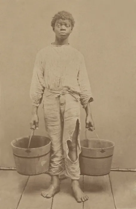 Framed Print : African American youth, possibly a former slave, holding two buckets, c. 1870. Photo by Isaac Haas, Green Cove Springs, Florida (BSLOC_2018_5_91)