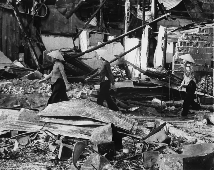 Framed Print : Aftermath of Tet Offensive. Three Vietnamese women return to their homes in the ruins in of the Cholon area of Saigon after a Viet Cong Tet Offensive. January 31, 1968 Framed Print : Aftermath of Tet Offensive. Three Vietnamese women return to their homes in the ruins in of the Cholon area of Saigon after a Viet Cong Tet Offensive. January 31, 1968