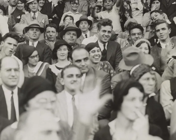 Framed Print : Al Capone (center), seated in front of three women, watching a college football game