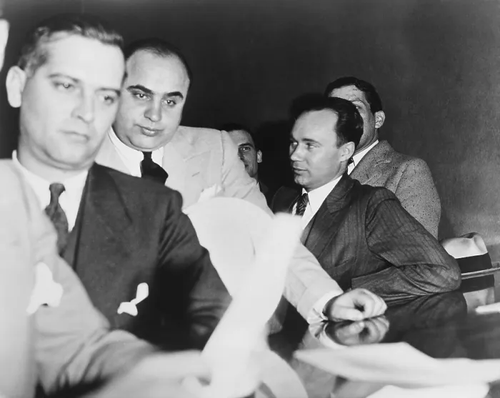 Framed Print : Al Capone, at the time of his indictment for tax evasion, June 5, 1931. At right is one of Capone's attorneys, Michael Ahern. - (BSLOC_2015_1_12)