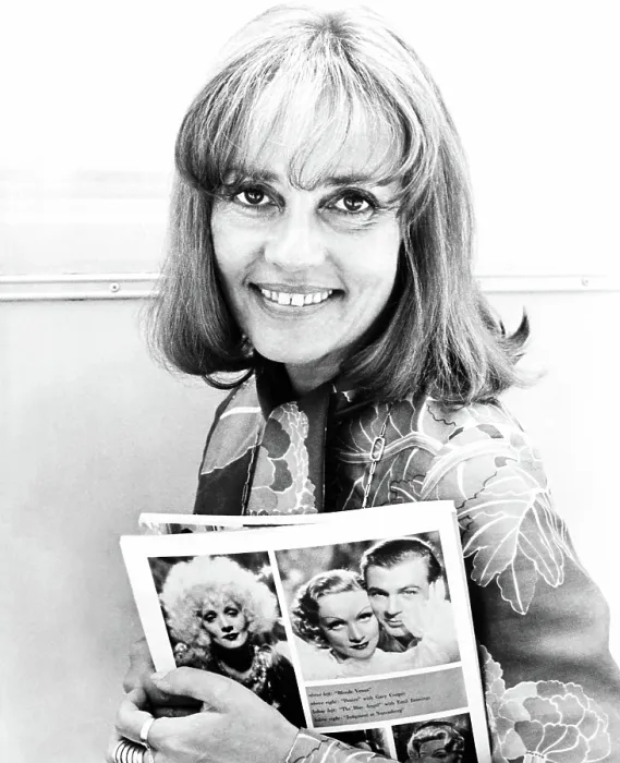 Framed Print : ALEX IN WONDERLAND, Jeanne Moreau (holding photos of Marlene Dietrich and Gary Cooper in BLONDE VENUS and DESIRE), 1970
