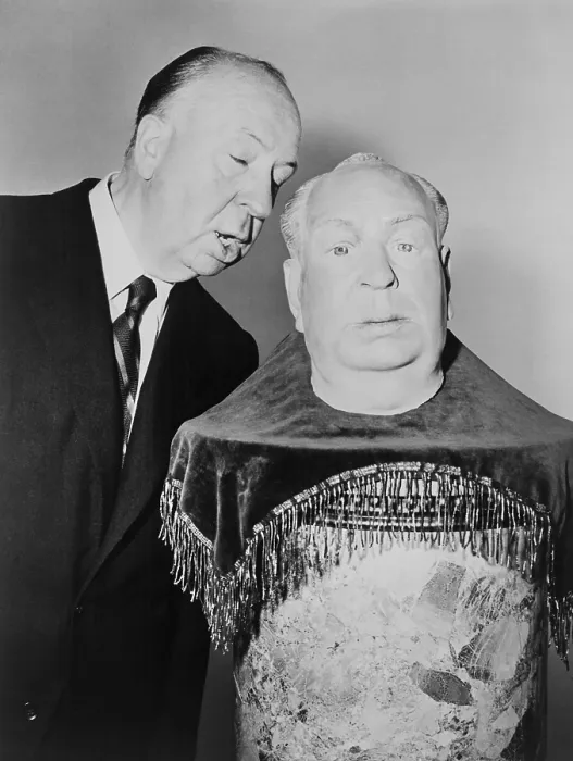 Framed Print : Alfred Hitchcock whispering into the ear of a plaster sculpture of his head Framed Print : Alfred Hitchcock whispering into the ear of a plaster sculpture of his head