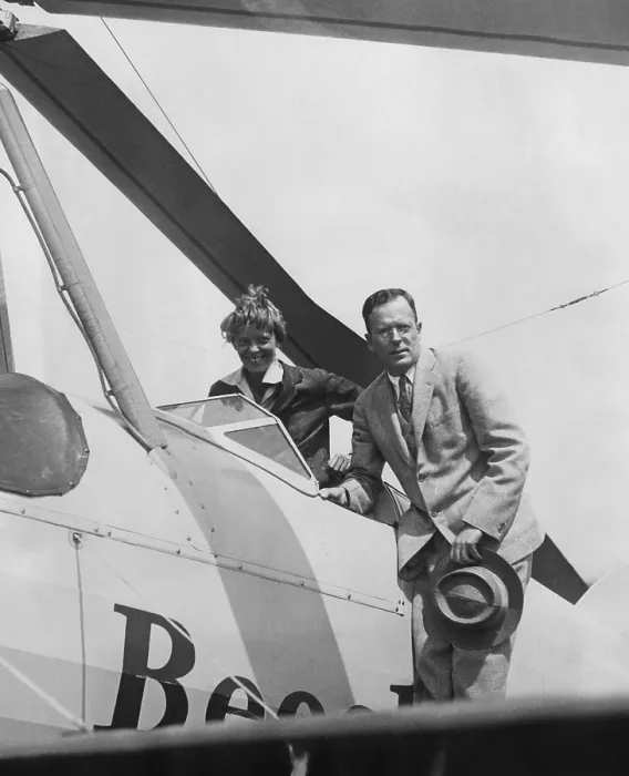 Framed Print : Amelia Earhart greeted by her husband George Palmer Putnam on her return to Newark Airport, New Jersey after a trans-continental flight. June 22, 1931