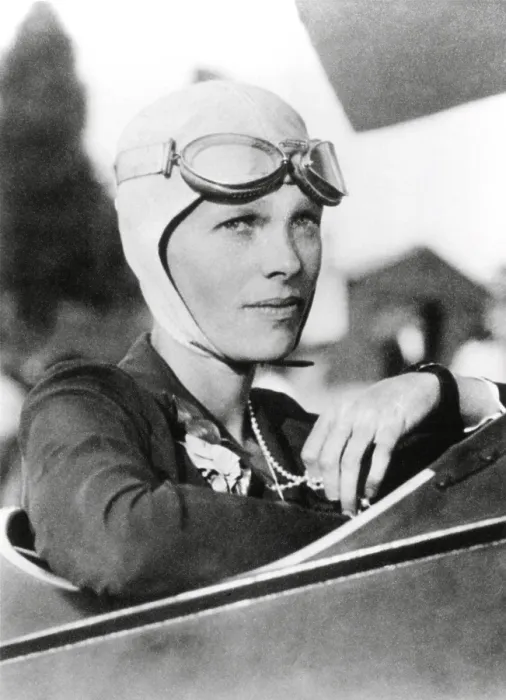 Framed Print : Amelia Earhart, record breaking women aviator in the cockpit of her plane, wearing goggles and close-fitting cloth helmet, ca. 1925-1930 (BSLOC_2021_3_1)