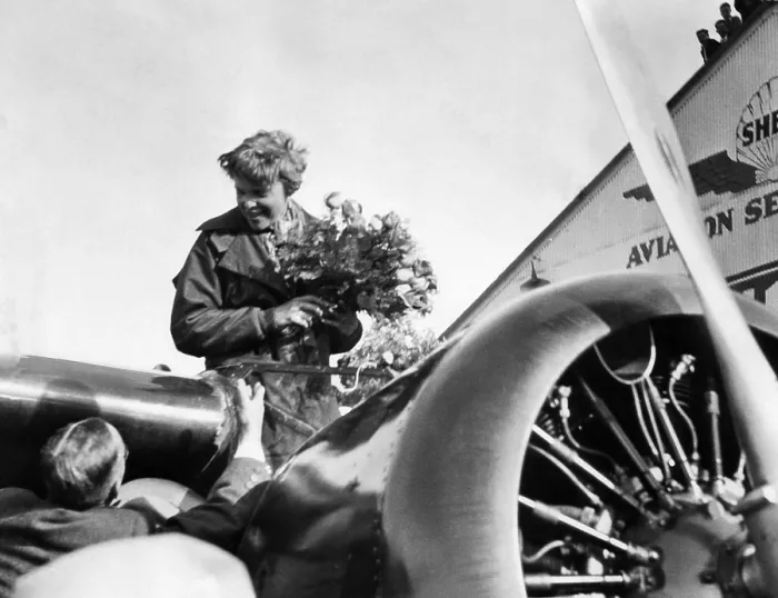 Framed Print : Amelia Earhart shown just after landing at Oakland, California Municipal Airport, on the first solo flight across the Pacific Ocean