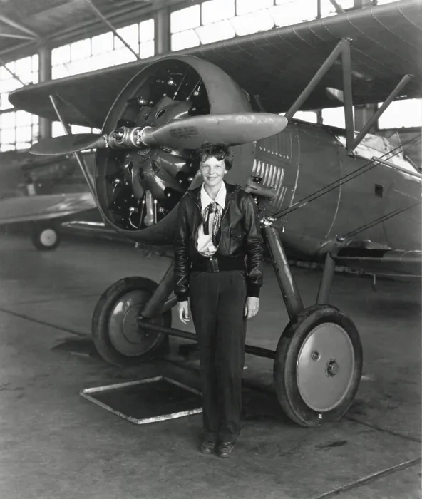 Framed Print : Amelia Earhart standing next to an airplane, July 30, 1936. (BSLOC_2013_8_214) Framed Print : Amelia Earhart standing next to an airplane, July 30, 1936. (BSLOC_2013_8_214)