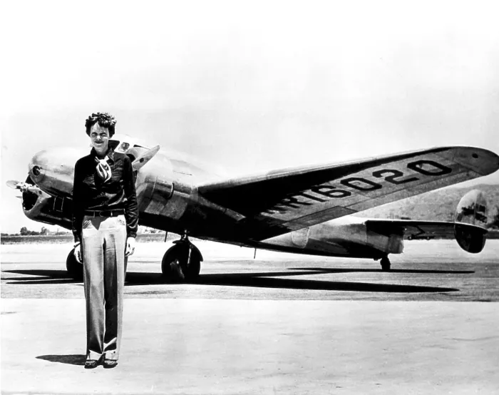 Framed Print : Amelia Earhart standing in front of the Lockheed Electra in which she disappeared in July 29, 1937 Framed Print : Amelia Earhart standing in front of the Lockheed Electra in which she disappeared in July 29, 1937