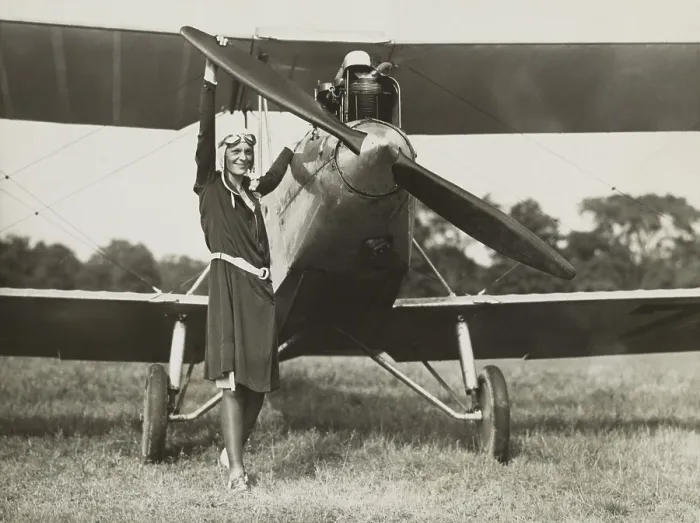 Framed Print : Amelia Earhart, turning the propeller of the sports plane she bought in 1928. The plane was previously owned by Mary, Lady Heath, an Irish aviatrix