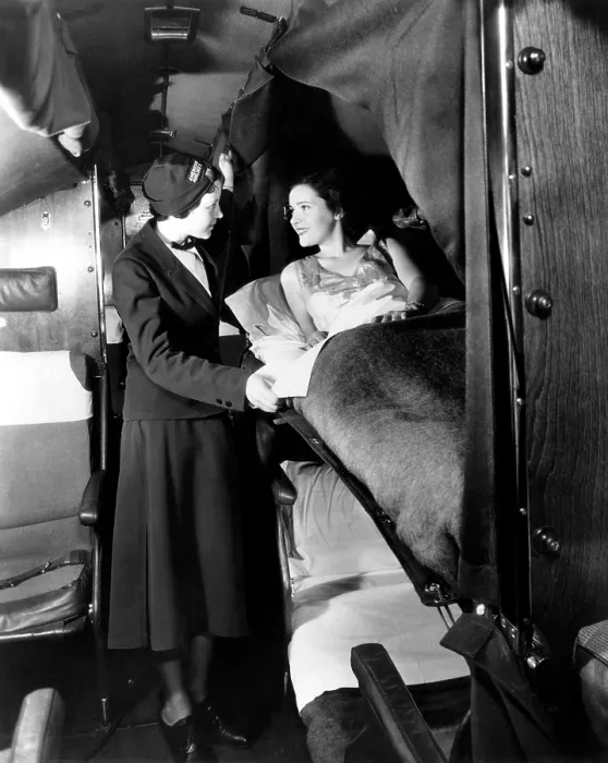 Framed Print : American Airlines stewardess checks on passenger in sleeper airplane, 1935. Courtesy: CSU Archives / Everett Collection Framed Print : American Airlines stewardess checks on passenger in sleeper airplane, 1935. Courtesy: CSU Archives / Everett Collection