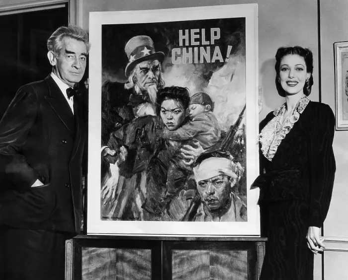 Framed Print : American artist and cartoonist James Montgomery Flagg and actress Loretta Young, beside the poster he created for the United China Relief Campaign. ca