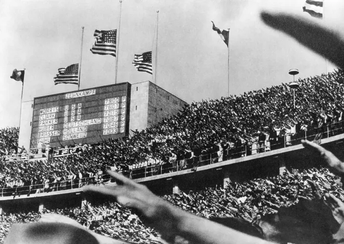 Framed Print : American flags fly over the Berlin Olympic stadium, marking the tops scores of American decathletes Framed Print : American flags fly over the Berlin Olympic stadium, marking the tops scores of American decathletes