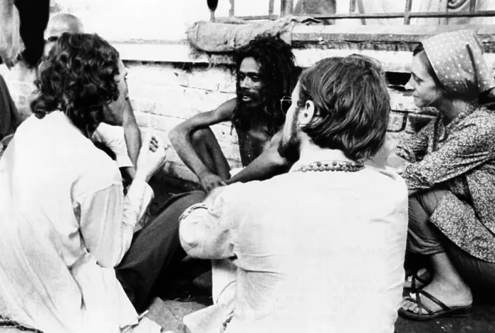 Framed Print : American hippies in Katmandu, Nepal. They talk with an Indian Sadhu, a Hindu Holy man, on a rooftop. The hippie community in Nepal ranged was estimated to be between 70 and 100