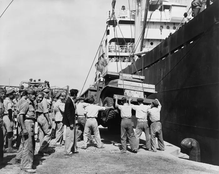 Framed Print : American-made truck lowered from a freighter at Piraeus as part of a relief effort to Greece. U.S