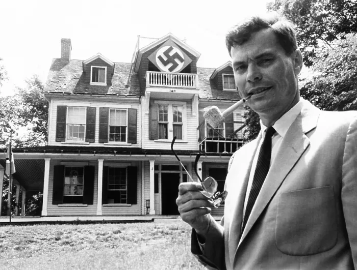 Framed Print : American Nazi George Lincoln Rockwell in front of the Swastika-marked house in Arlington, Virginia. He said the house was Nazi Party's headquarters and barracks
