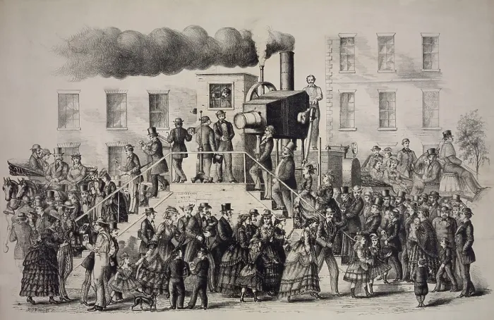 Framed Print : American print about the fad of photography, showing a large steam powered camera taking and developing photographs instantly. 1871 Framed Print : American print about the fad of photography, showing a large steam powered camera taking and developing photographs instantly. 1871