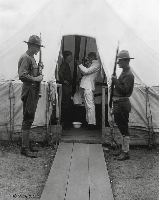 Framed Print : American soldier gets throat sprayed to prevent influenza. Dec. 1918. Medical tent at Love Field, Dallas, Texas, during the 1918-19 Spanish Influenza pandemic