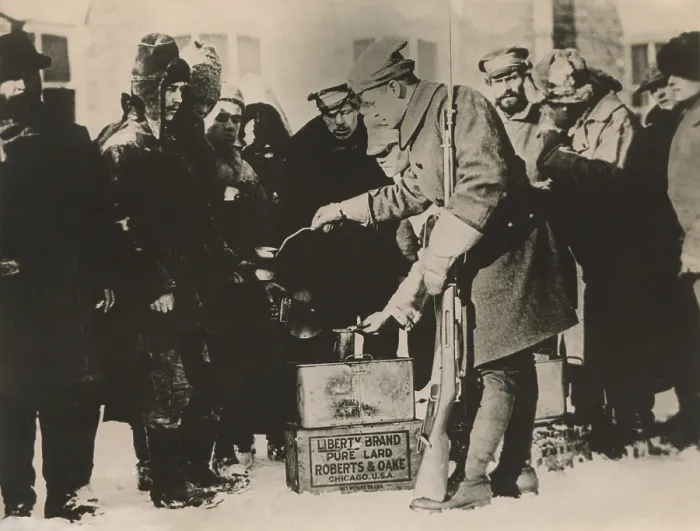 Framed Print : American soldier ladling out soup to Russian POWs in Archangelsk, Russia, during World War 1 Framed Print : American soldier ladling out soup to Russian POWs in Archangelsk, Russia, during World War 1