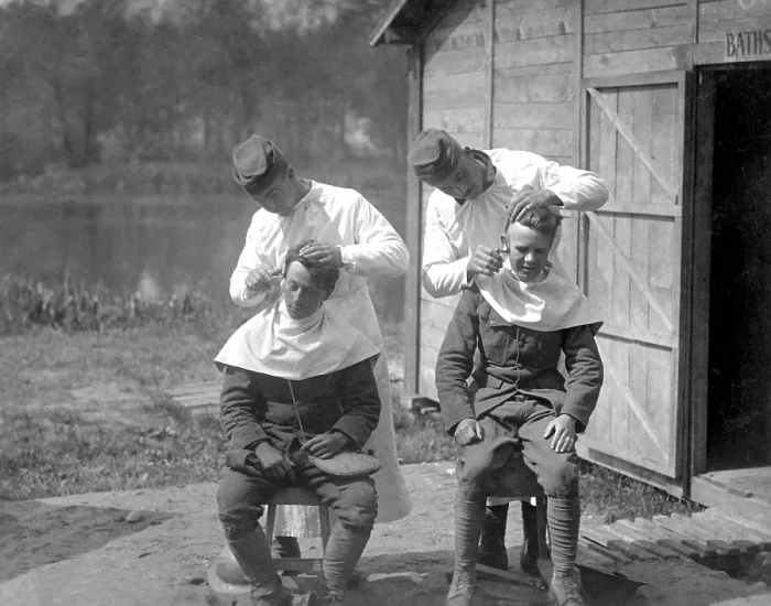 Framed Print : American soldiers get hair cuts at the 166th Field Hospital, Baccarat, France. World War I. May 15, 1918