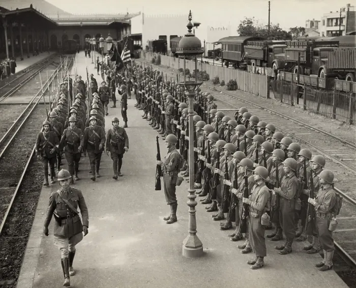 Framed Print : American soldiers present arms as French soldiers march past in Oran, Algeria, Dec. 2, 1942