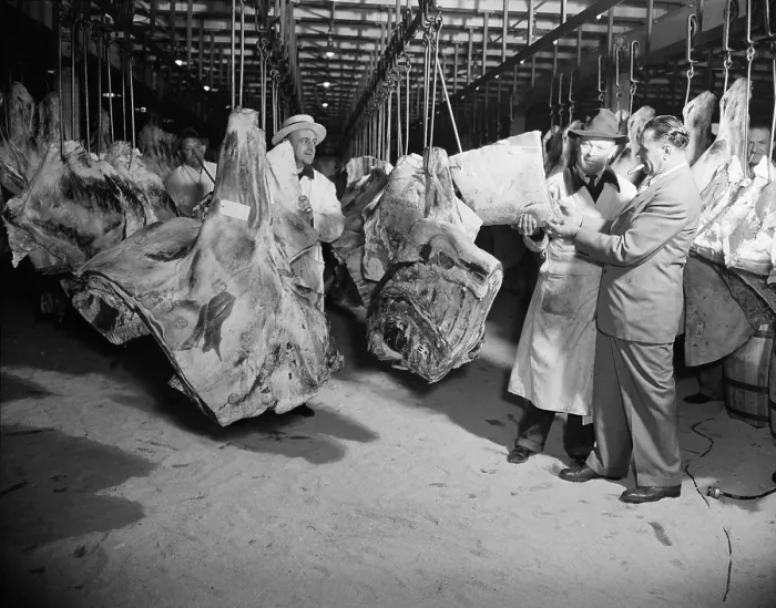 Framed Print : American wholesale meat market during World War 2. The meat bears government inspection stamps