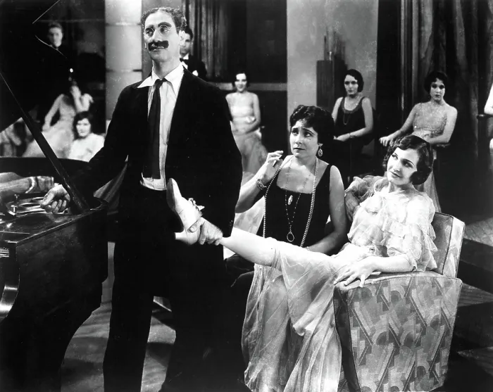 Framed Print : ANIMAL CRACKERS, Groucho Marx, Margaret Dumont, 1930, holding her leg