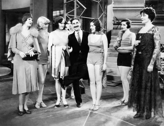 Framed Print : ANIMAL CRACKERS, Margaret Irving (left), Groucho Marx (raised leg), Margaret Dumont (right), 1930