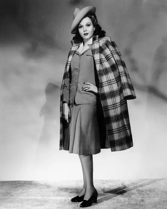 Framed Print : Ann Miller wearing light blue suit and plaid overcoat, 1941 Framed Print : Ann Miller wearing light blue suit and plaid overcoat, 1941